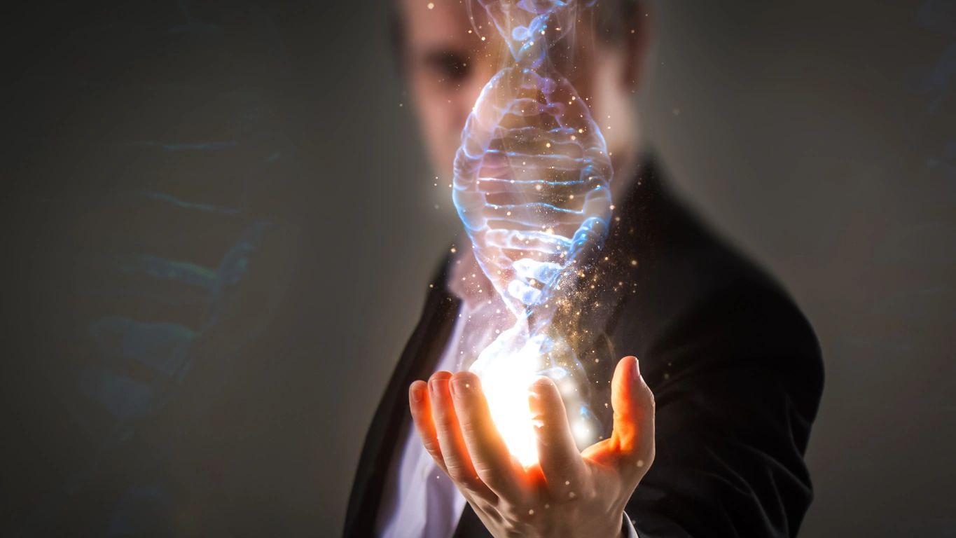 Person holding glowing DNA helix representing biotechnology innovation